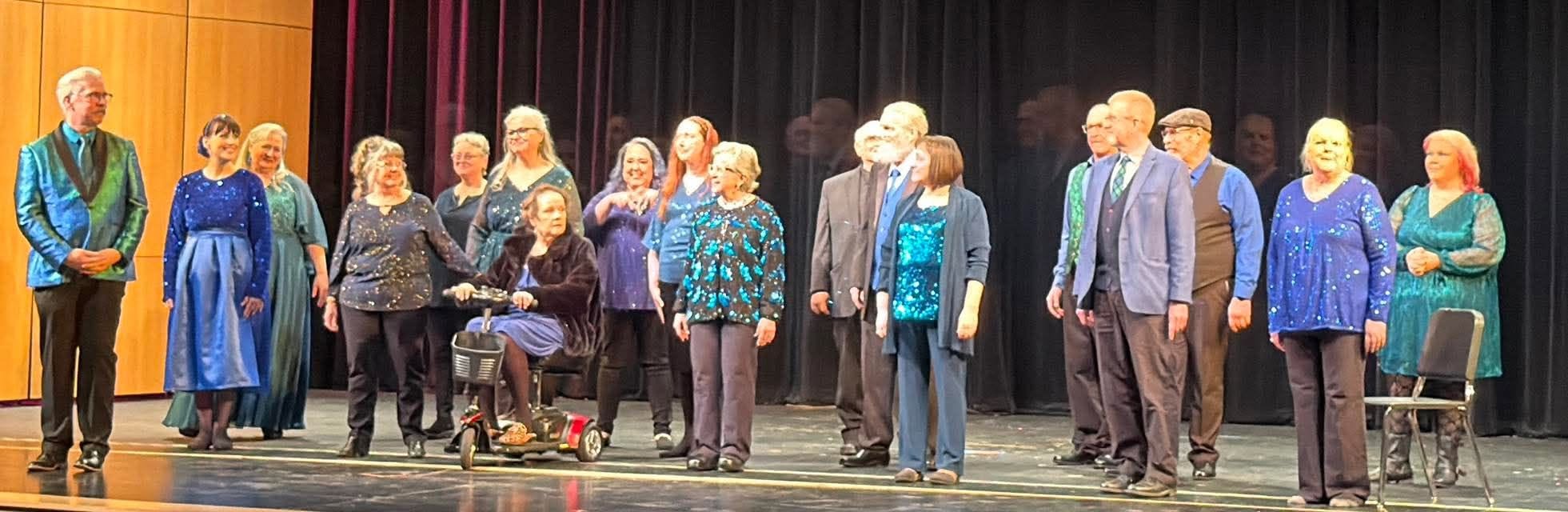 Voices of the Sound chorus members together on stage
